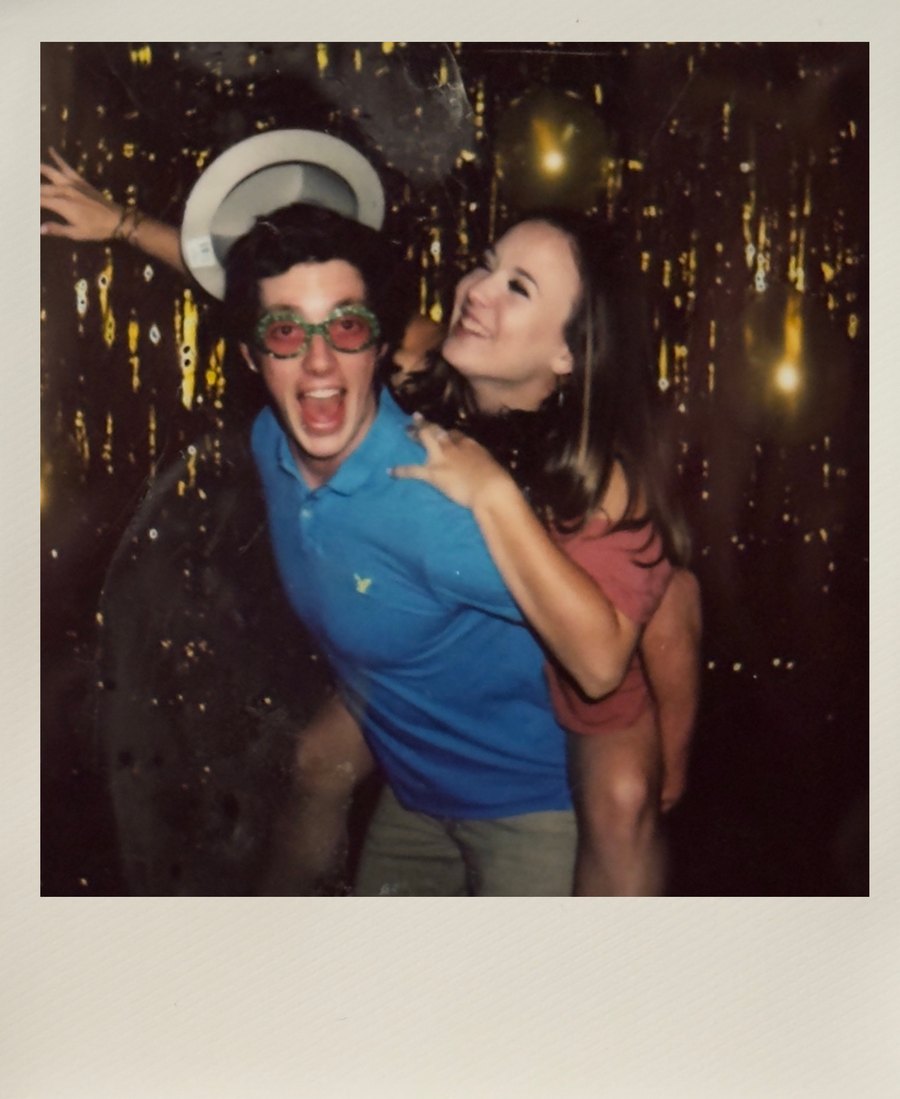 Instant wedding photo of guests celebrating on the dance floor